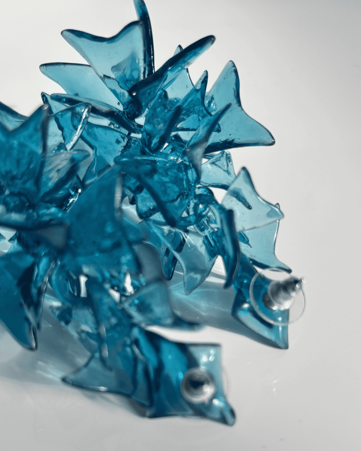 Cobalt blue statement earrings product photo, showing the full sculptural shape