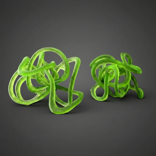 Front view of statement green earrings in a bold sculptural design.