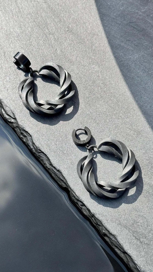 Side profile of contemporary costume jewelry hoops showing the infinite loop.