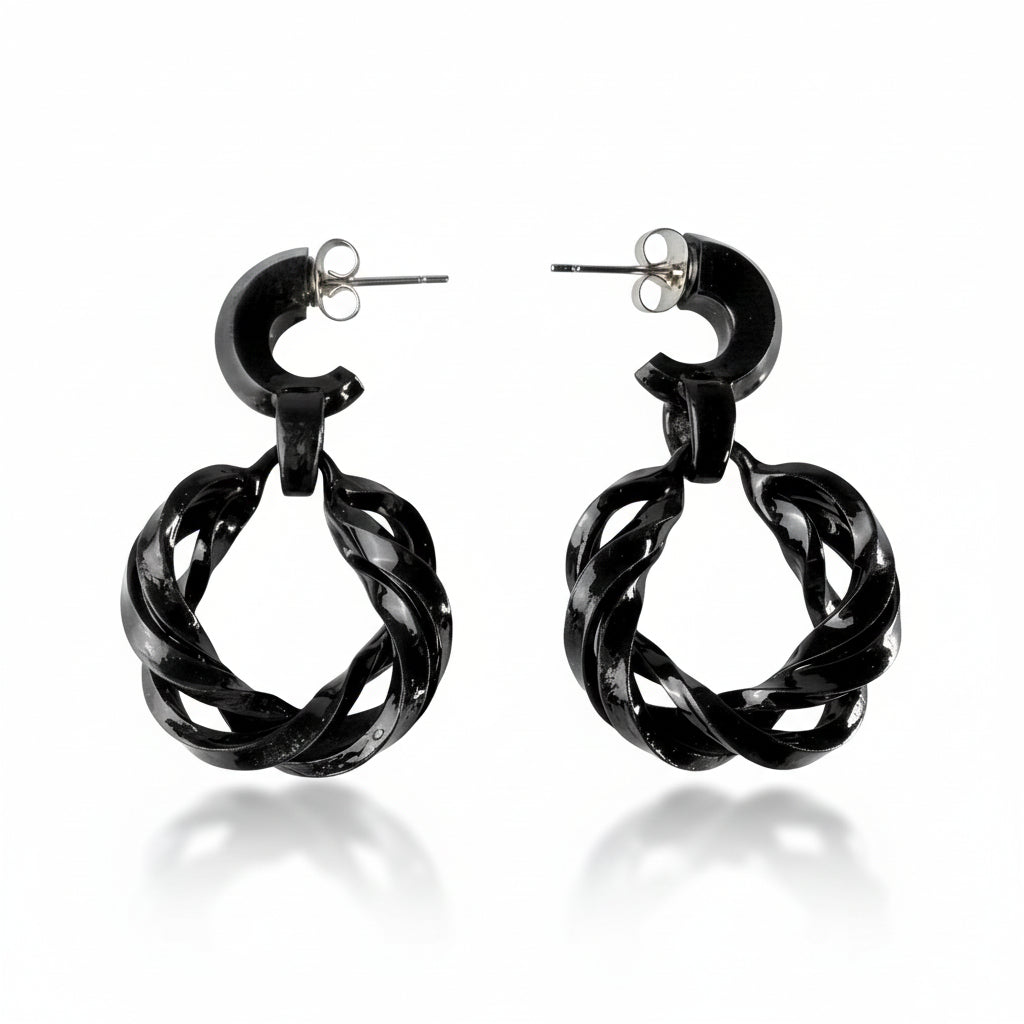 Black hoop earrings on a white background