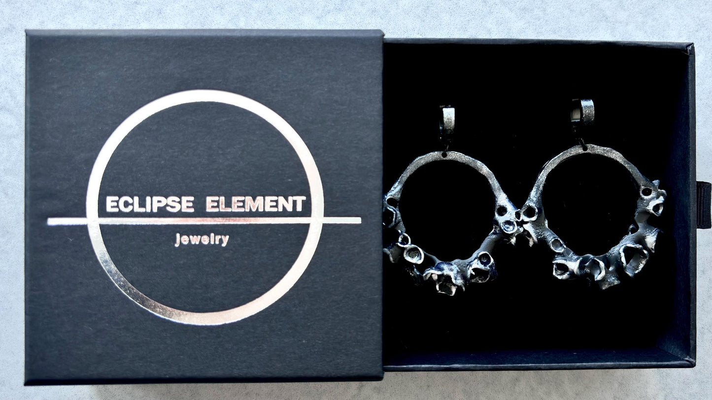 Earrings in a branded jewelry box