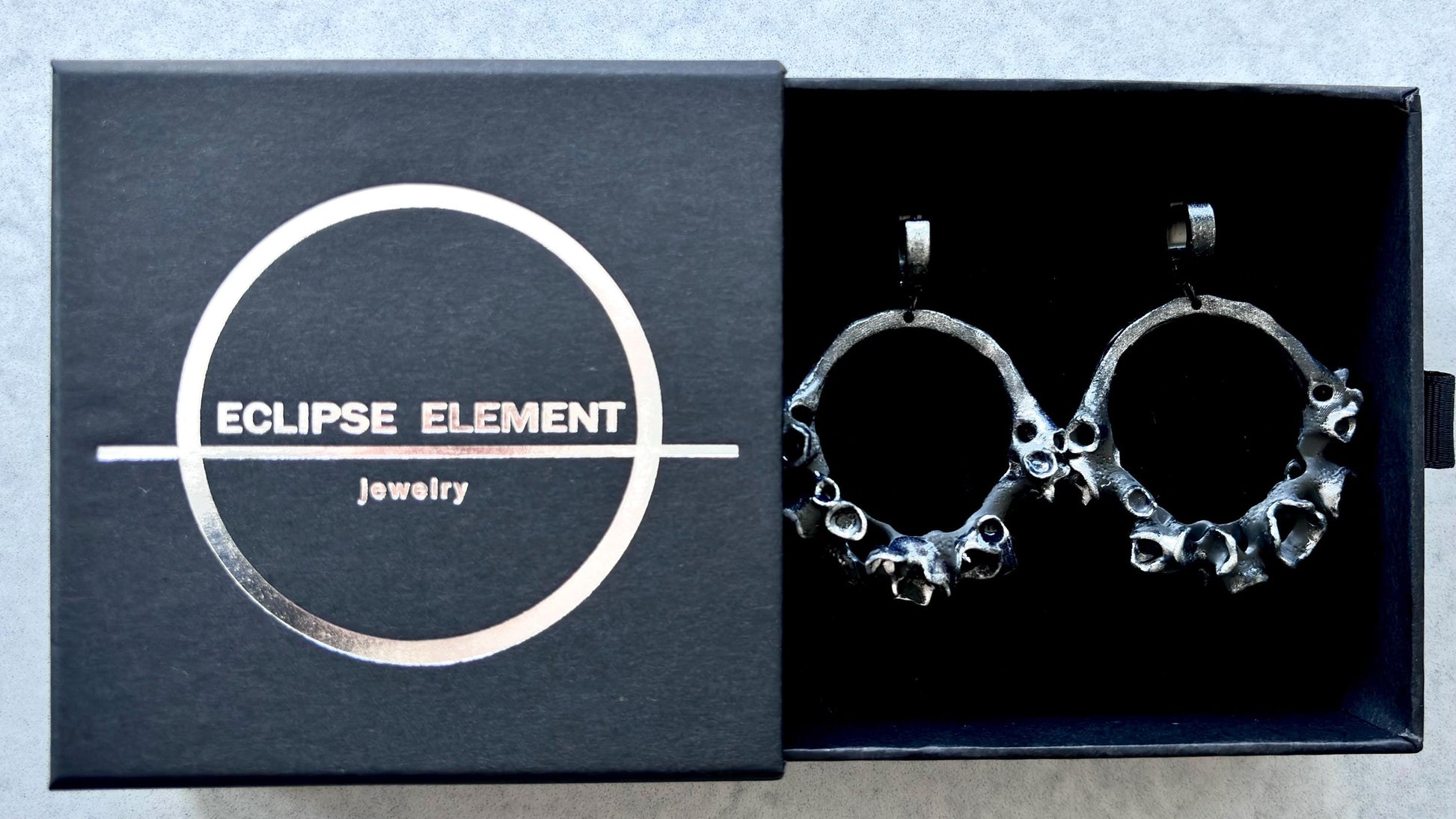 Earrings in a branded jewelry box