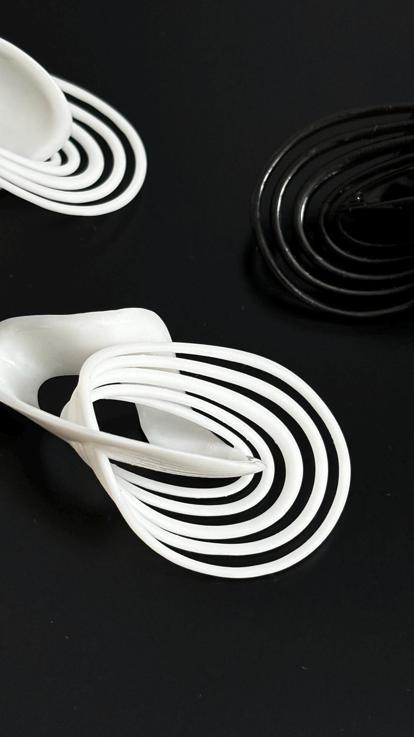 Infinity Loops Statement Earrings black and white, looks like orbits