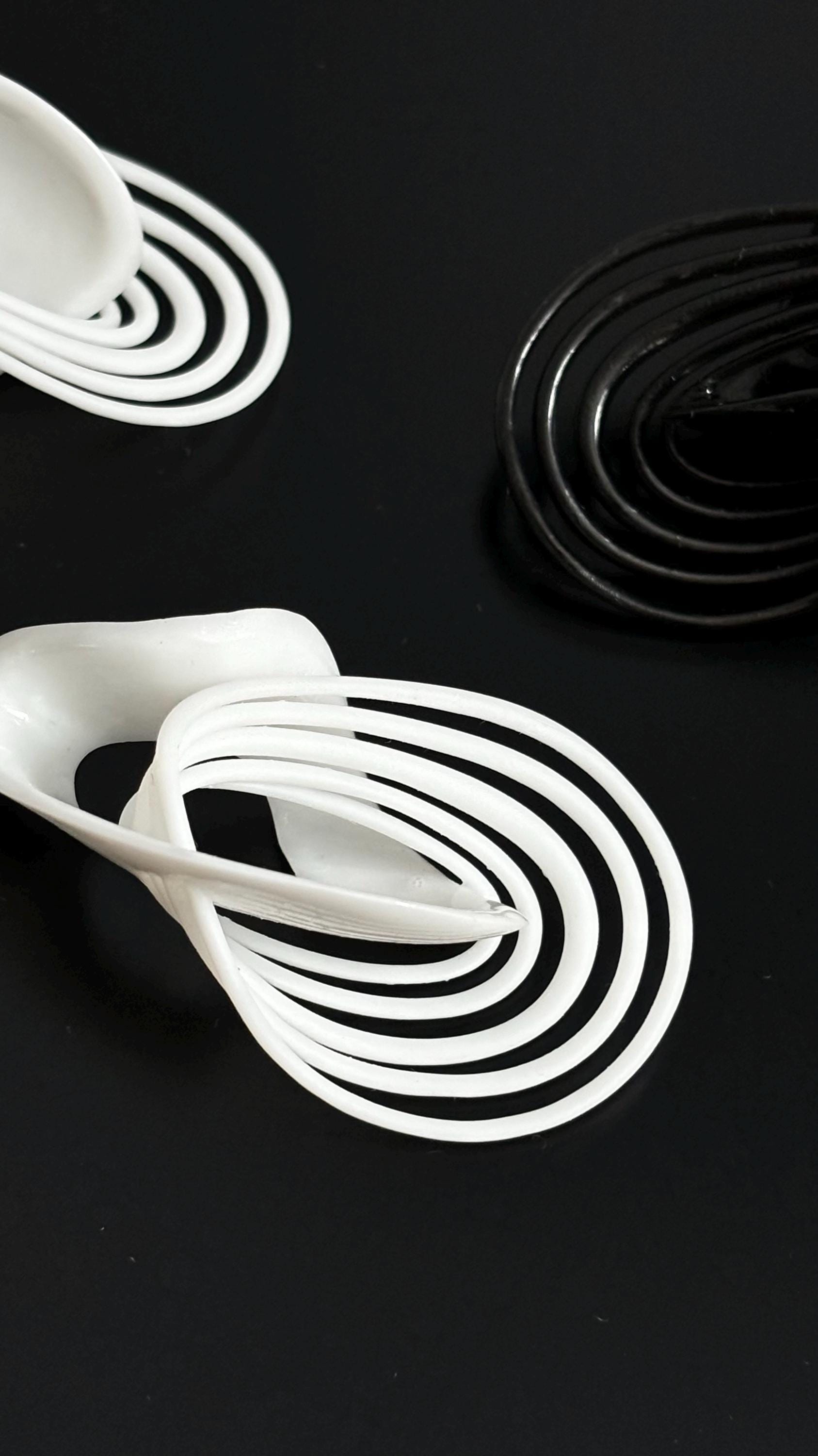 Infinity Loops Statement Earrings black and white, looks like orbits