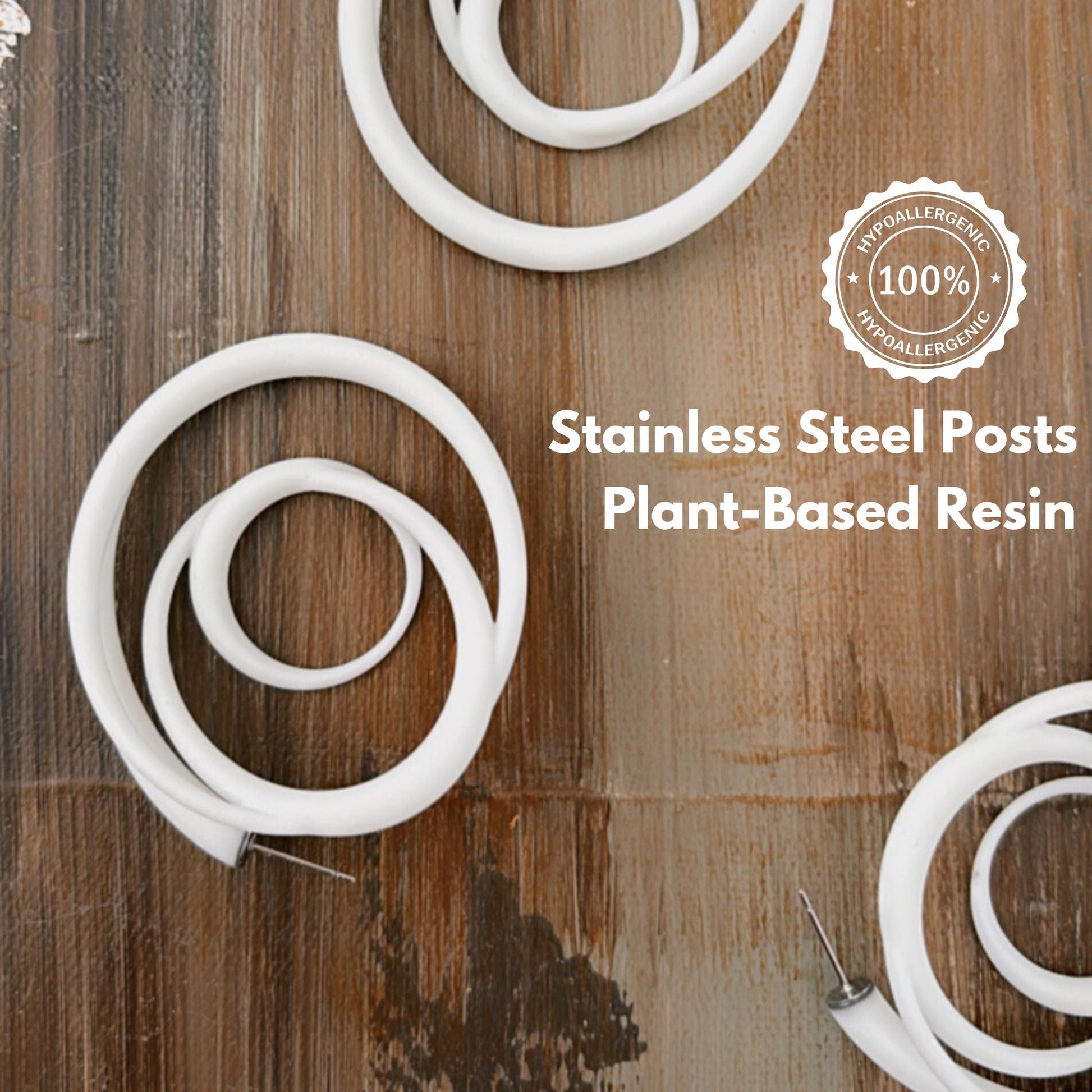 Rear view of swirl hoops showing stainless steel posts and plant-based resin tag