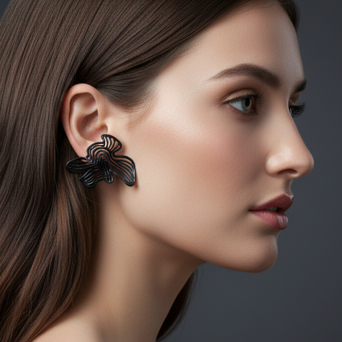 Full model shot wearing black statement earrings, showing the proportional impact.
