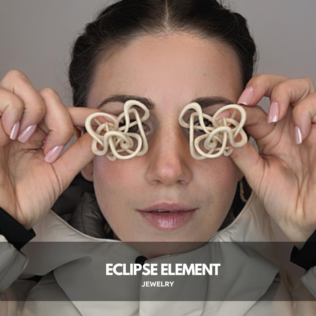 Model holding Ivory Celestial Loops over eyes, centered view for social media