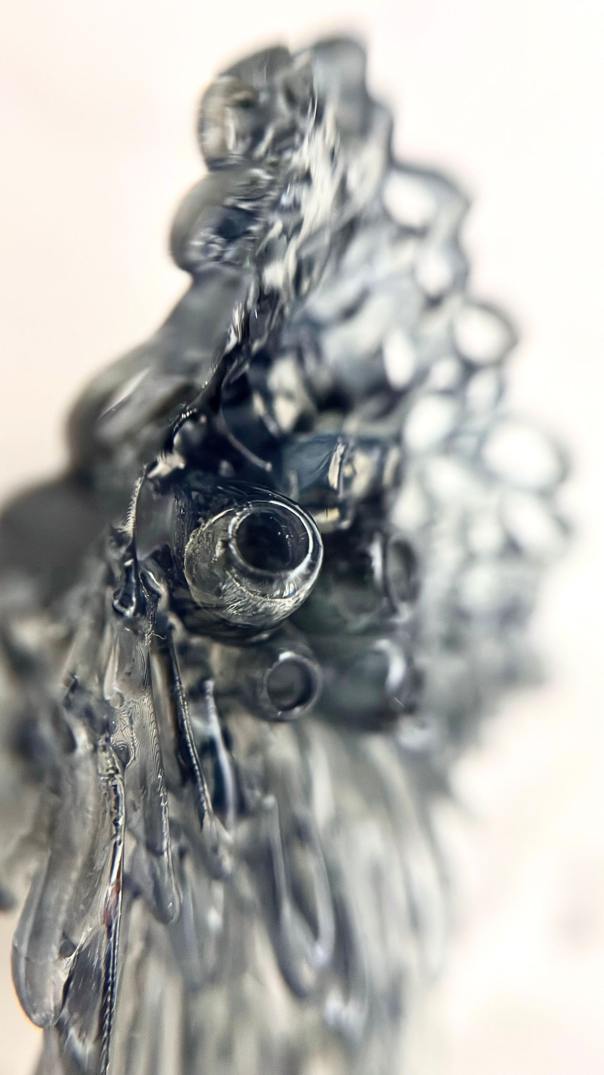 Extreme side-profile close-up of a single Coral Lace earring