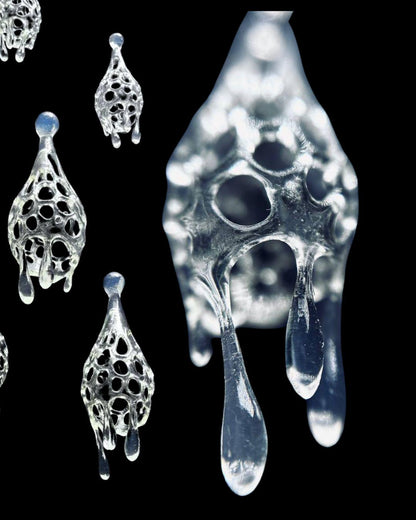 A pair of ice crystal-inspired drop earrings with a transparent and intricate design, suspended from stainless steel posts.