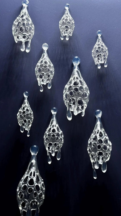 Fluid abstract earrings styled to look like elegant drops of rain.