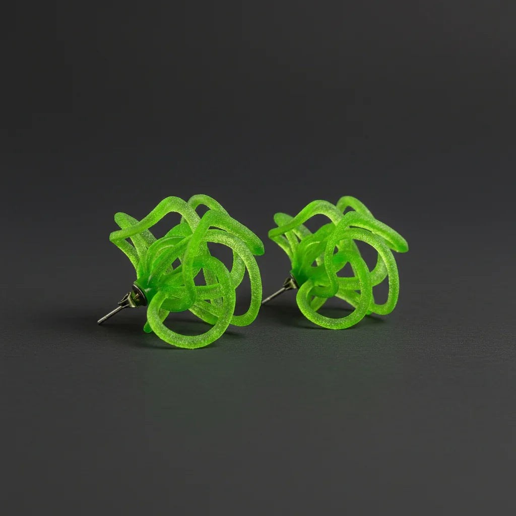 Pair of green fashion jewelry loops showing the vibrant emerald shade.