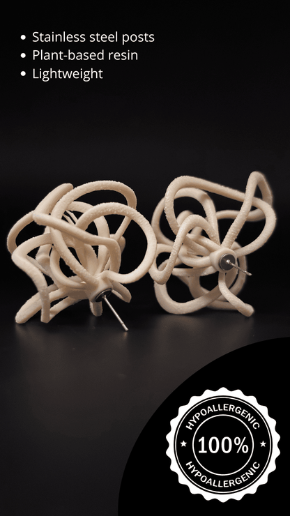 Detailed back view of the cream statement earrings, emphasizing the quality finish.