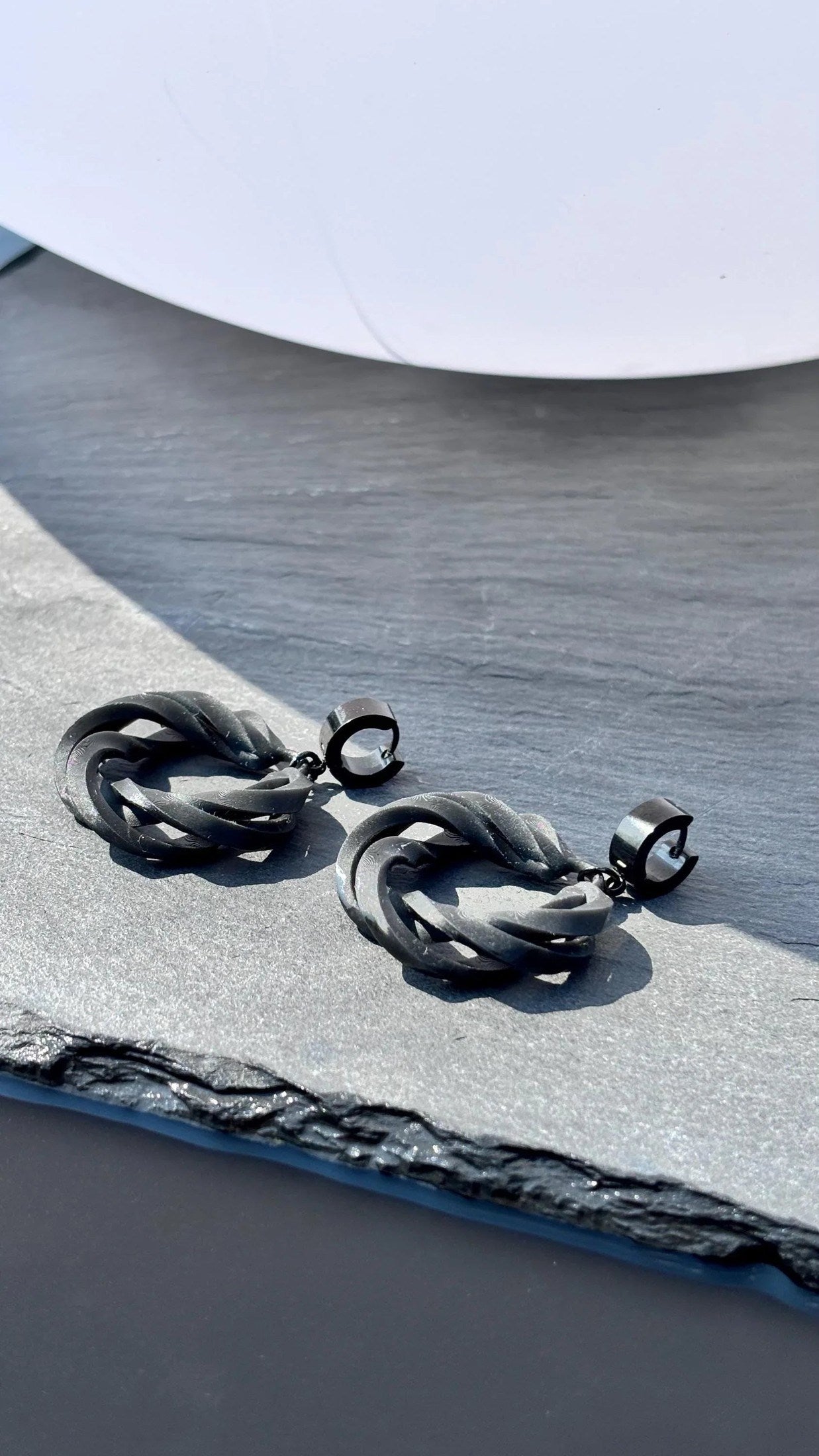 Angled shot of statement fashion jewelry, highlighting the 3D-sculpted texture.