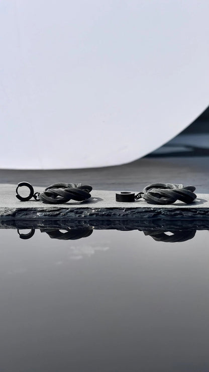 Close-up of black and white costume jewelry aesthetics in a noir finish.