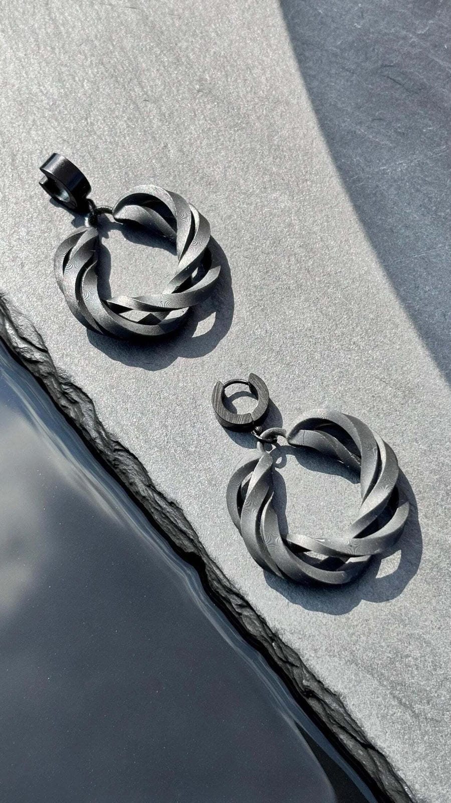 Side profile of contemporary costume jewelry hoops showing the infinite loop.