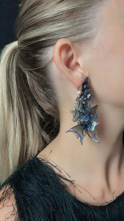 Side view of gothic jewelry for a perfect statement earrings outfit.