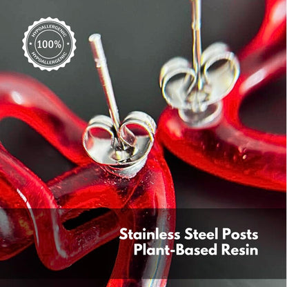 Close-up of red resin printed earrings with stainless steel posts and plant-based resin.