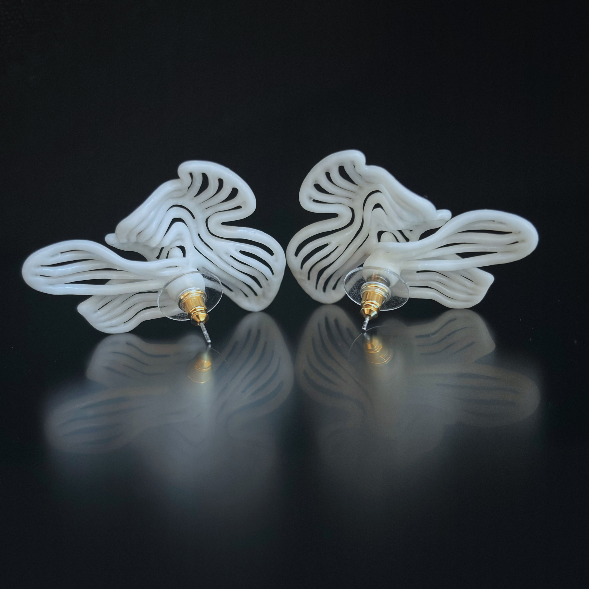 Rhythm White sculptural earrings and ring with a clean, minimalist styling