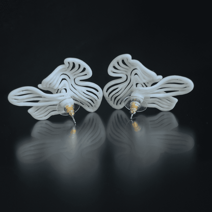 esthetic earrings set shown from the side, demonstrating the thin, lightweight profile and finish.