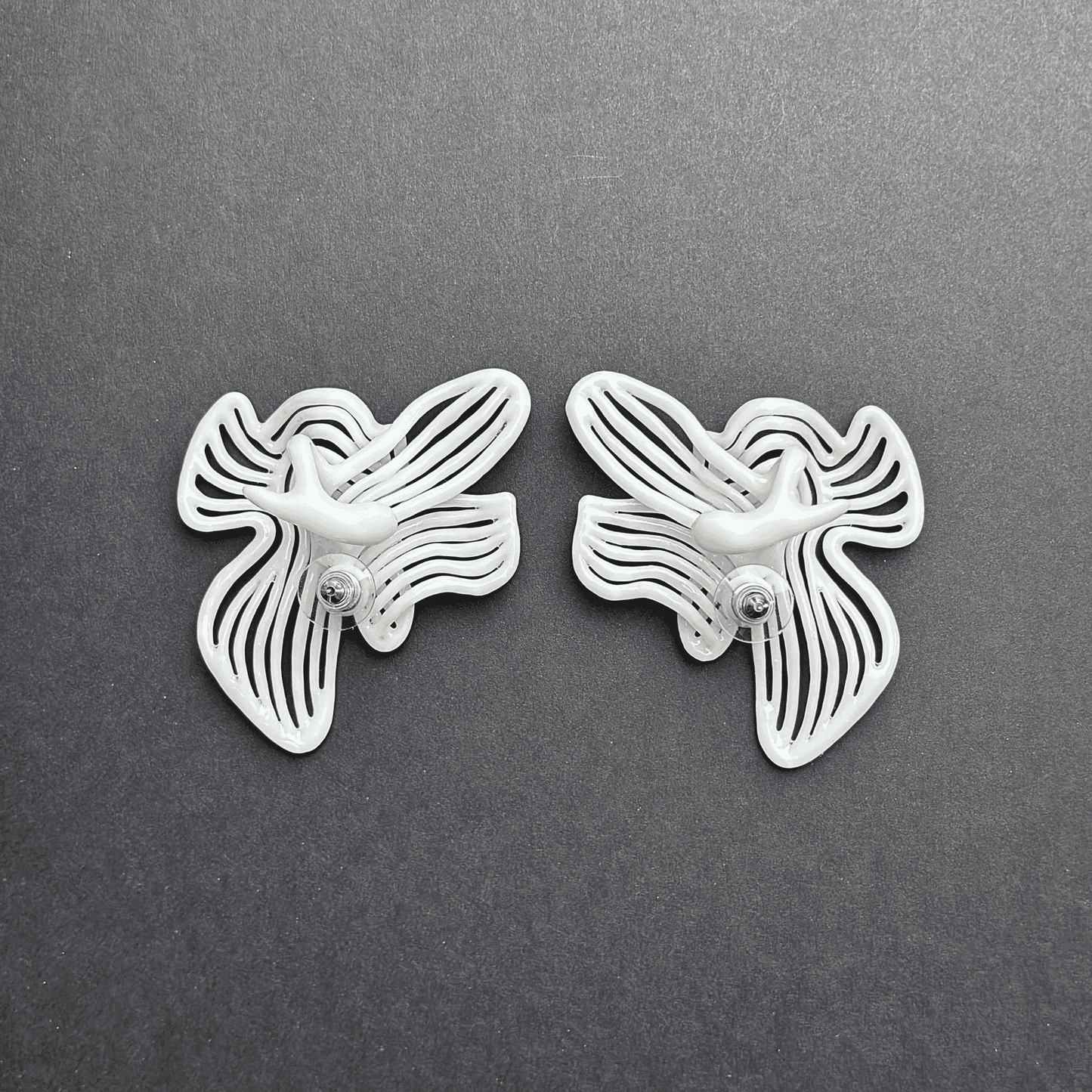 Studio photograph of wedding statement earrings on a clean background.